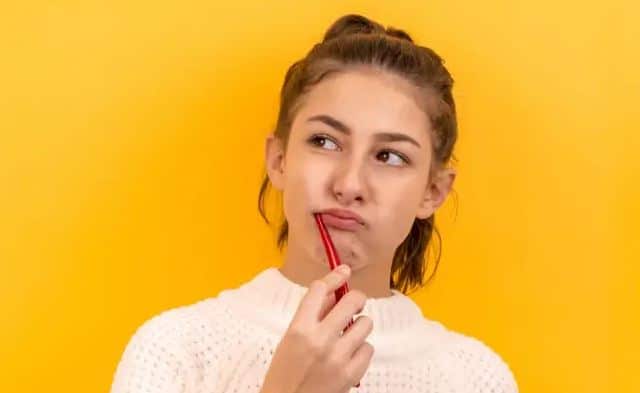 a girl brushing her teeth for preventive dental care